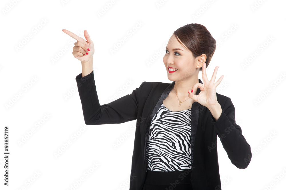 Young Asian business woman point and show OK Young Asian business woman point and show OK