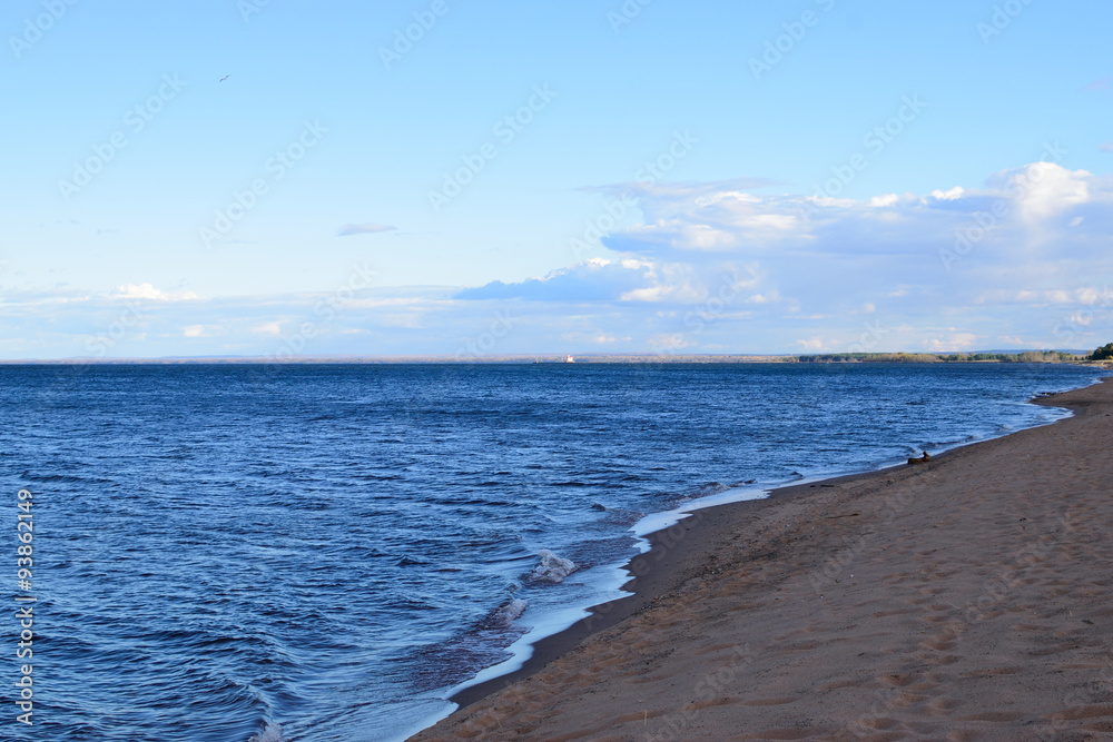 Distant Lighthouse on Lake Superior Shore