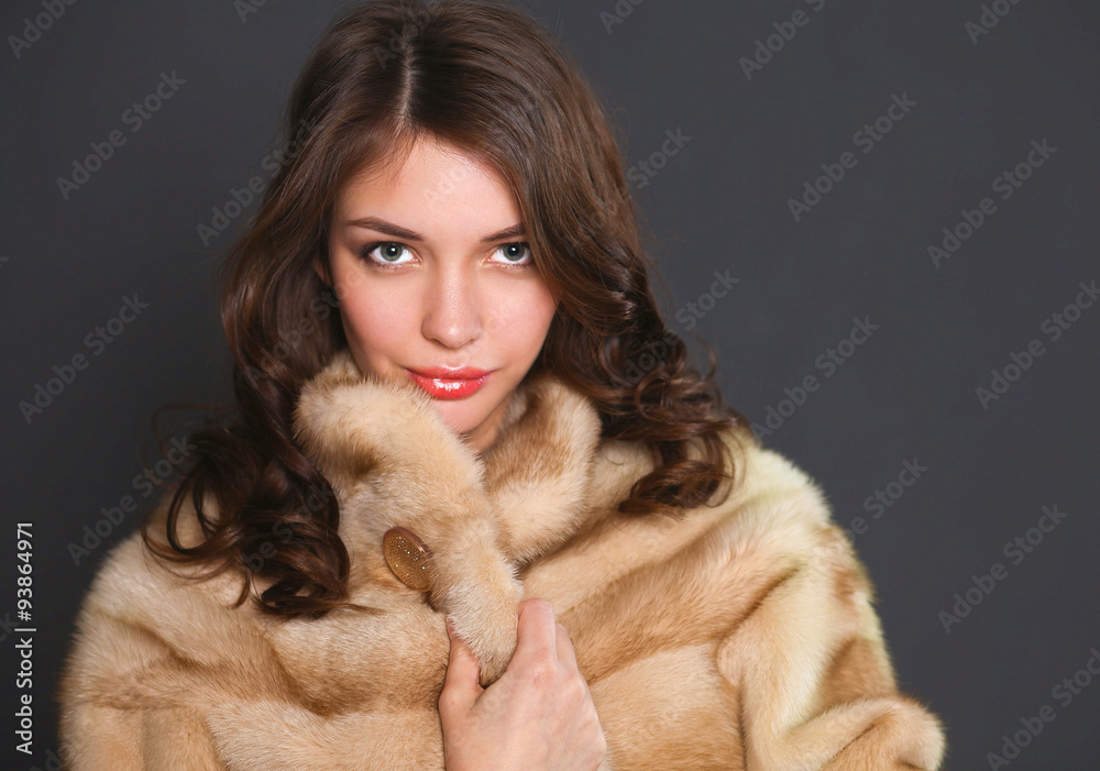 Portrait of a beautiful woman in jacket with fur. Portrait of a beautiful woman in jacket with fur.