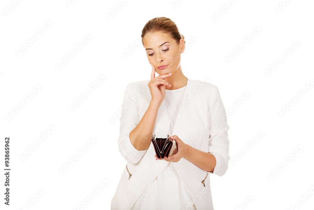 Young businesswoman holds empty wallet Young businesswoman holds empty wallet