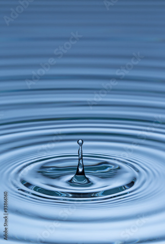 Blue water drop falling