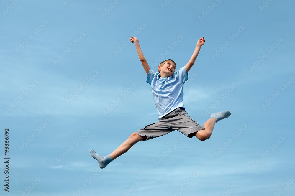jumping boy against sky background jumping boy against sky background