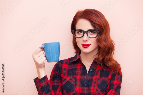 Girl holding blue cup photo