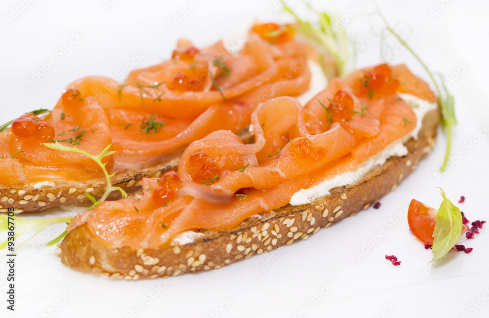 sandwiches with salmon caviar and greens adorned