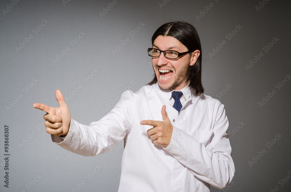 Male doctor against gray Male doctor against gray