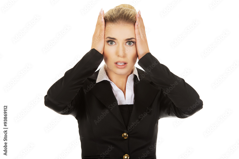 Young shocked businesswoman olding her head in amazement and op Young shocked businesswoman olding her head in amazement and op