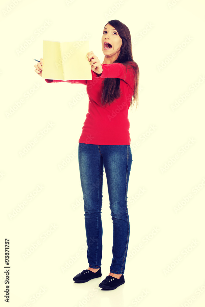 Shocked student woman with her note. Shocked student woman with her note.