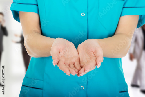 Doctor woman hand showing something on palms.