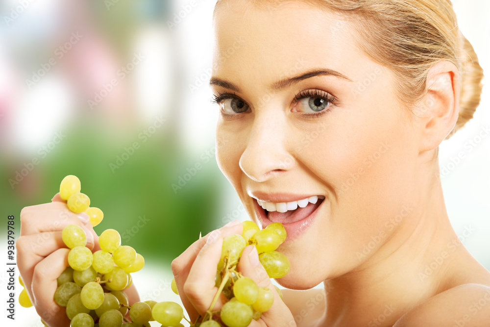Portrait of nude woman eating grapes Portrait of nude woman eating grapes
