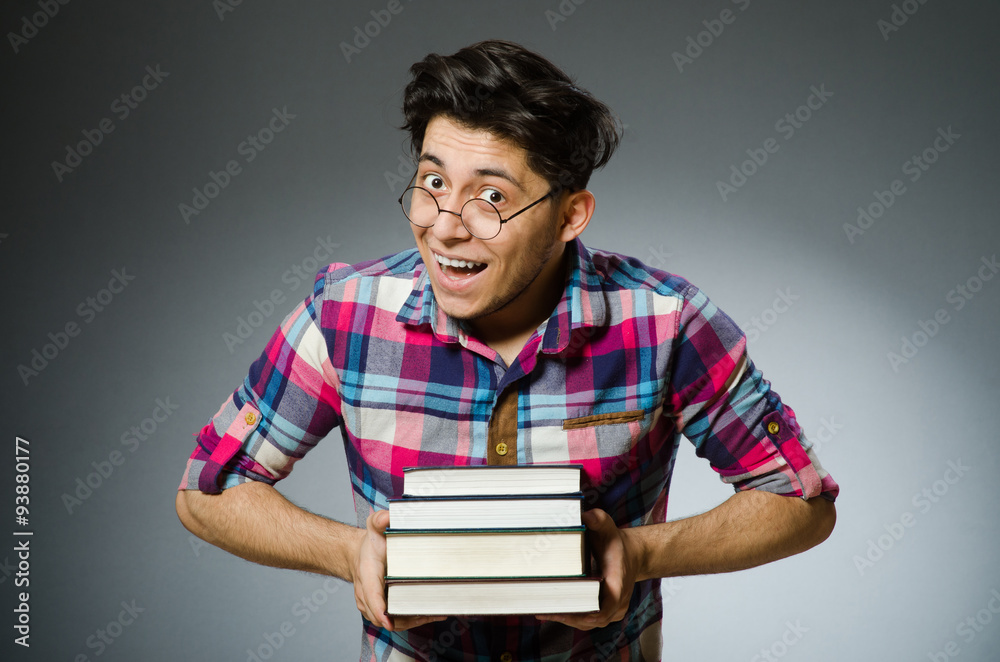 Funny student with many books Funny student with many books