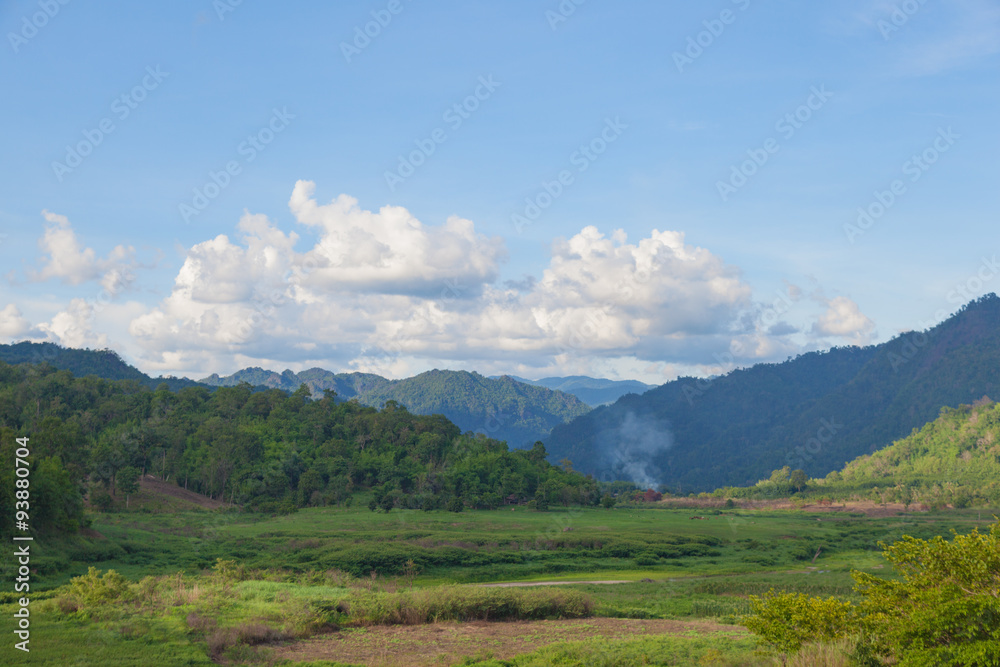 Forest-covered mountains around