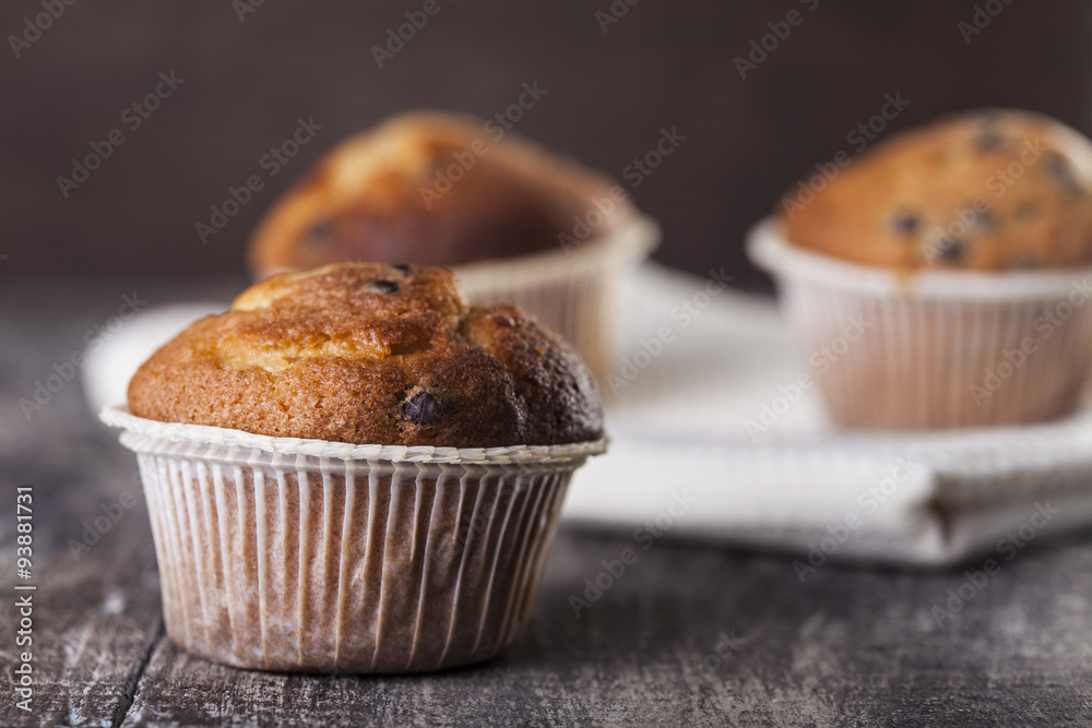 Chocolate muffin on a wooden background Chocolate muffin on a wooden background