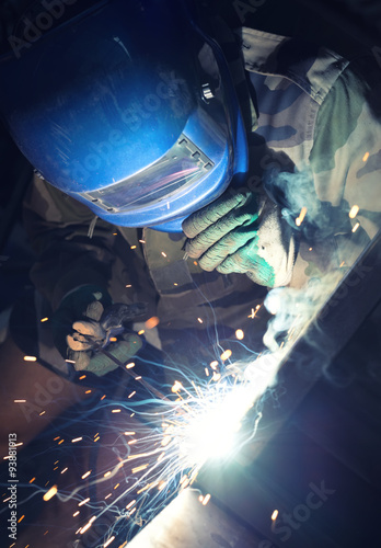 Welding and bright sparks. Concept and idea of hard job.
