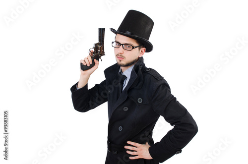 Young detective in black coat holding handgun isolated on white