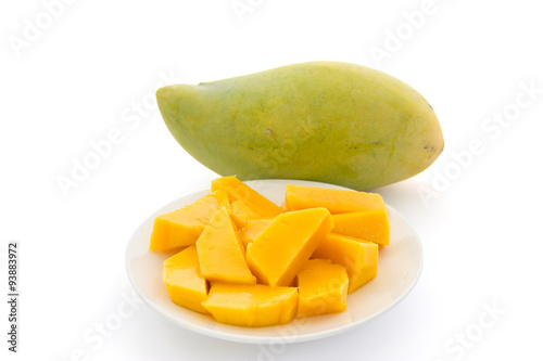 Mango slices in plate isolated on white background