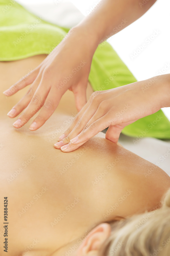 Naklejka premium Beautiful woman lying on a massage table and has massage.