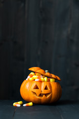 Jack o lantern filled with candy corn