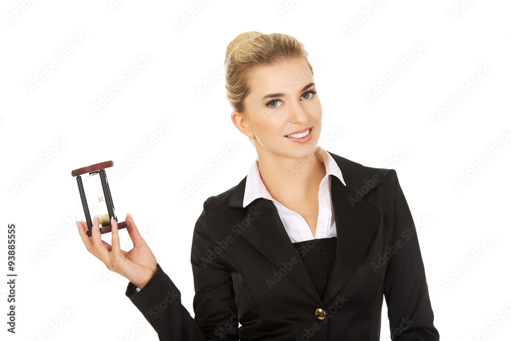 Young smile businesswoman with hourglass - time concept Young smile businesswoman with hourglass - time concept