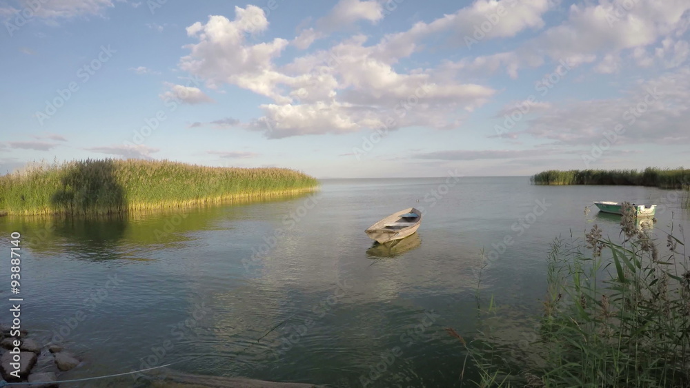 landscape with two boats on sea bay water and evening wind. Timelapse 4K landscape with two boats on sea bay water and evening wind. Timelapse 4K