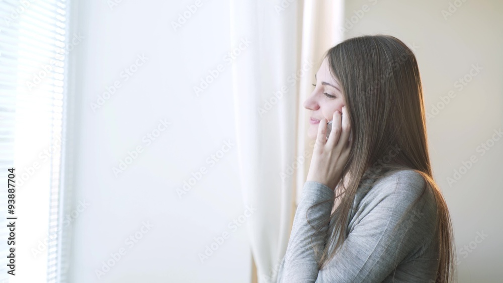 Beautiful woman talking on mobile phone. She's happy