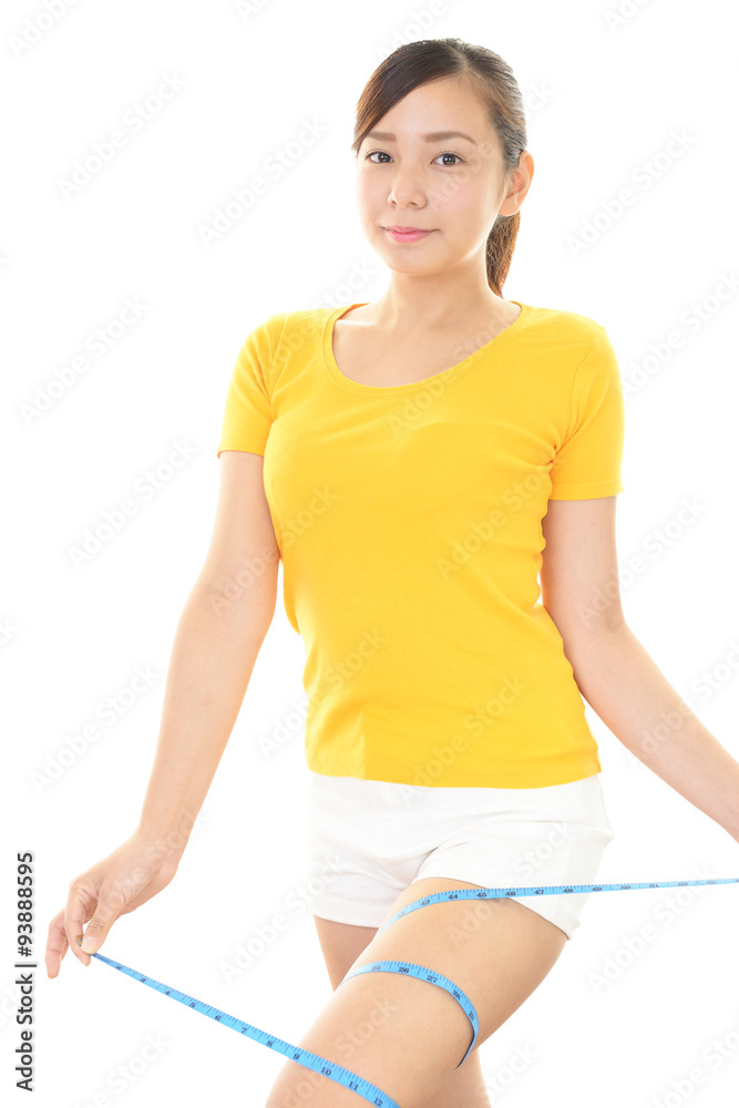 太ももを測る女性 太ももを測る女性