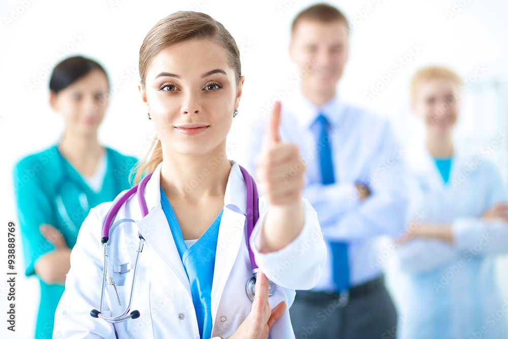 Young happy female doctor showing thumbs up Young happy female doctor showing thumbs up