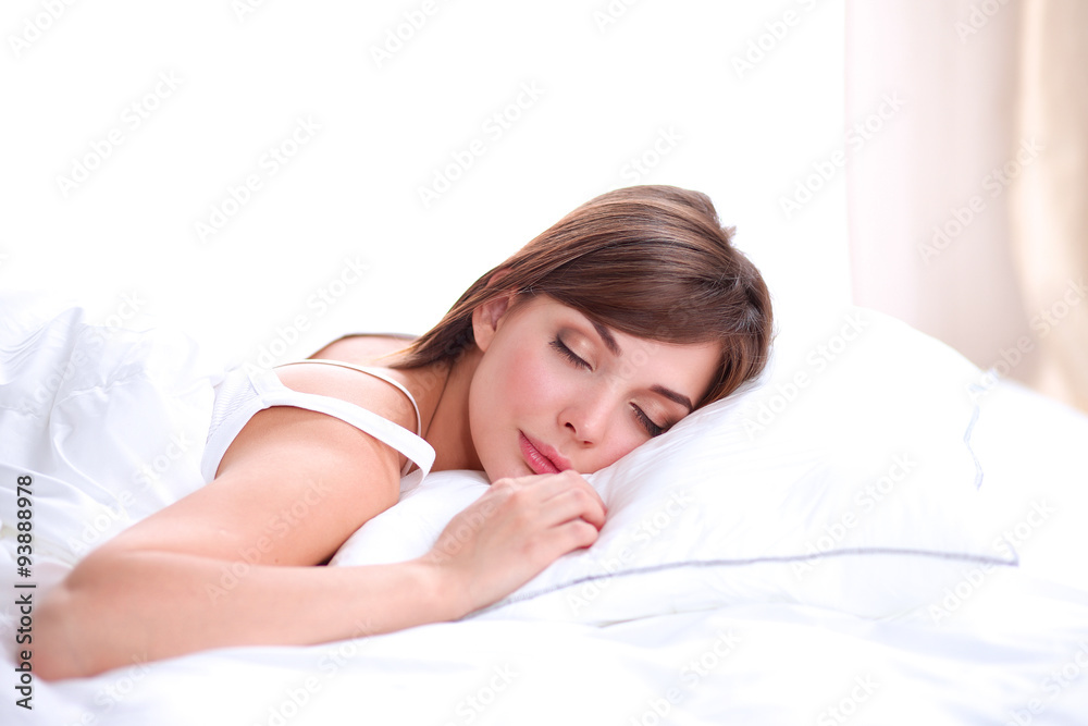 Beautiful girl sleeps in the bedroom, lying on bed Beautiful girl sleeps in the bedroom, lying on bed