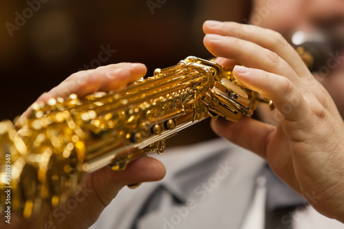 Hand of musician playing the soprano saxophone
