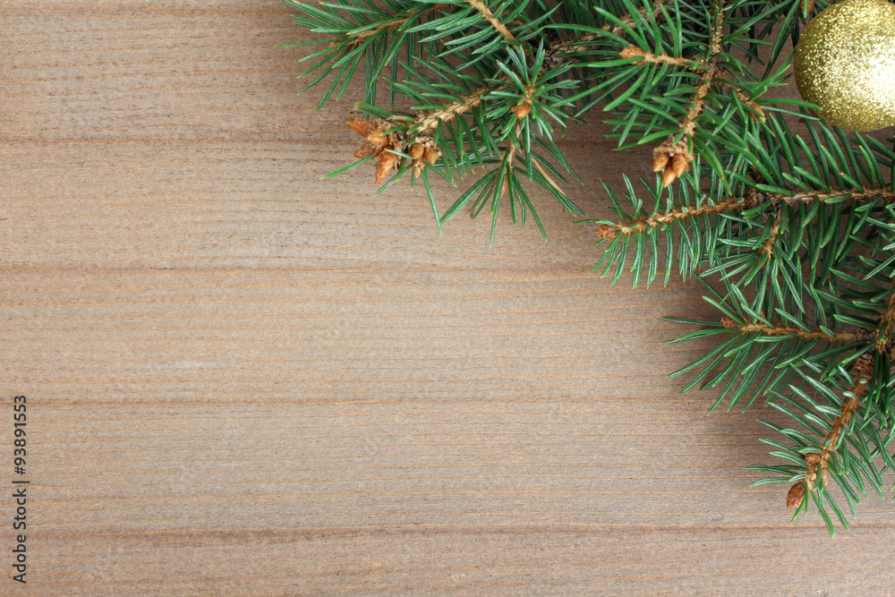 the branches and eating Christmas toy on a wooden background the branches and eating Christmas toy on a wooden background