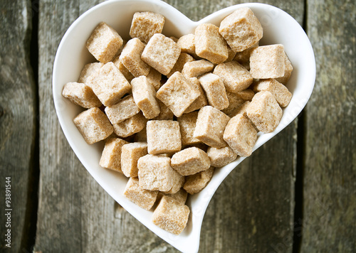 brown sugar cubes in a heart-shaped bowl