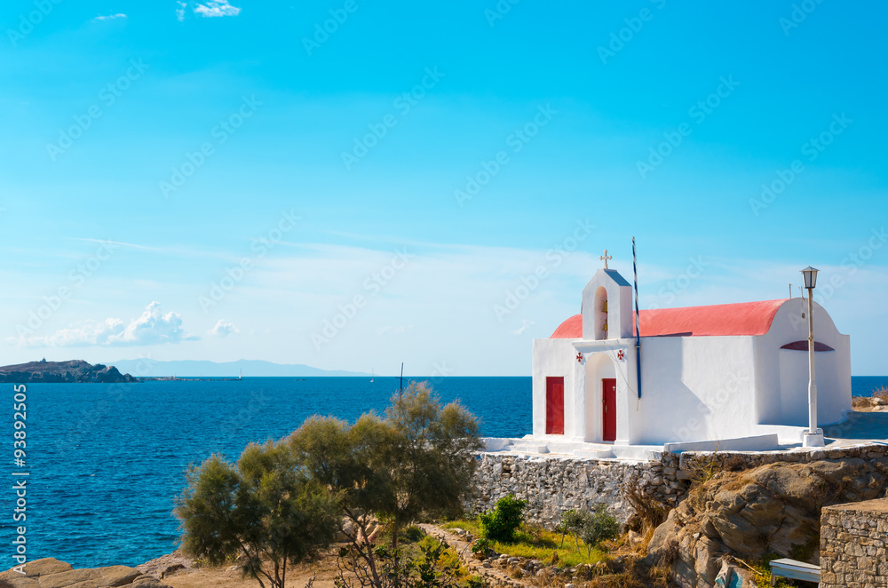 little greek orthodox chapel at the beach in mykonos, greece