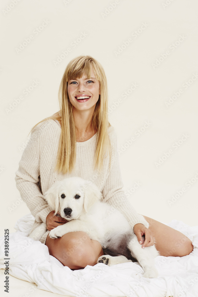 Young blond woman with puppy, portrait Young blond woman with puppy, portrait