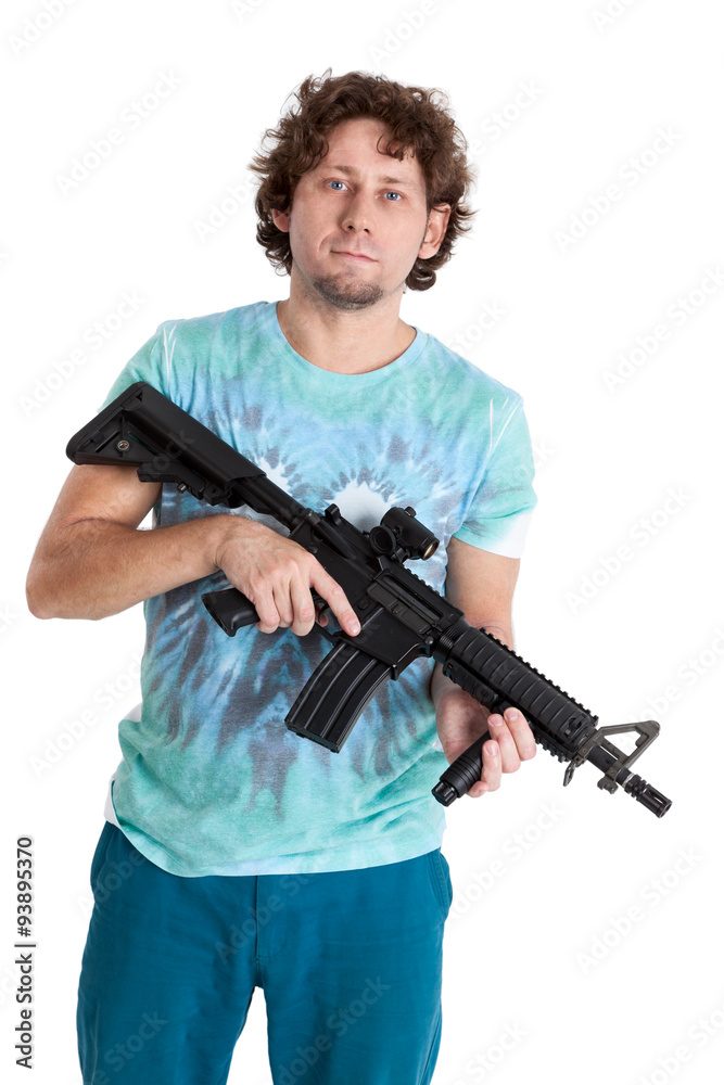 Curly hair man standing with machinegun in hands and looking at camera, isolated on white background Curly hair man standing with machinegun in hands and looking at camera, isolated on white background