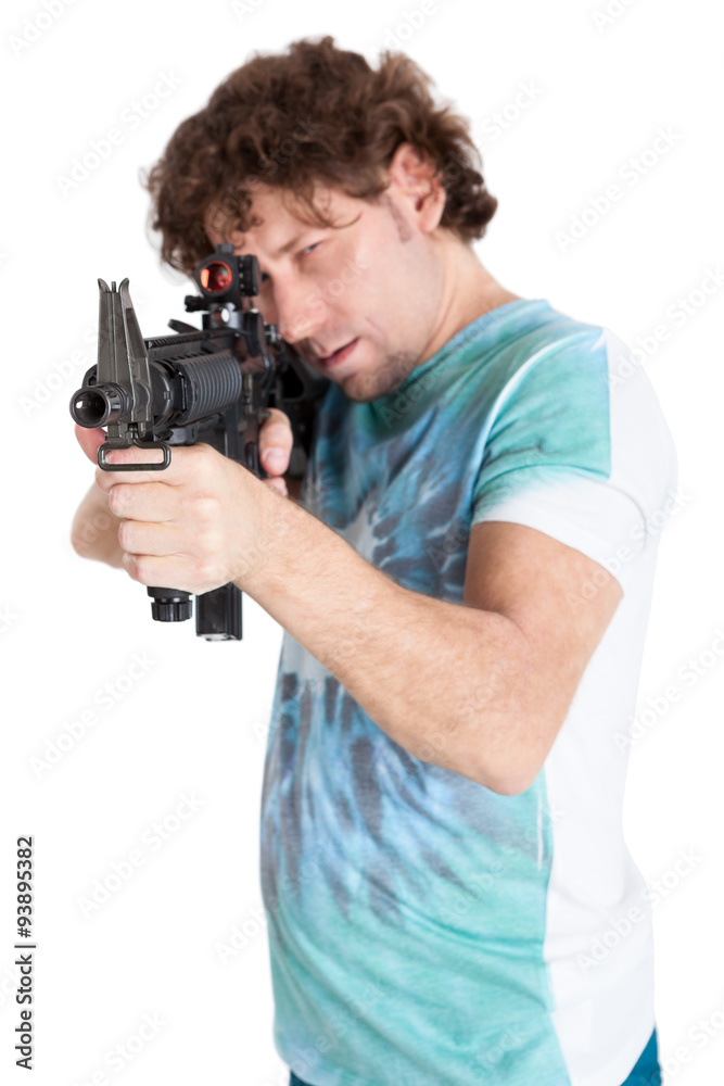 Caucasian curly hair man taking aim with a machinegun, isolated on white background Caucasian curly hair man taking aim with a machinegun, isolated on white background