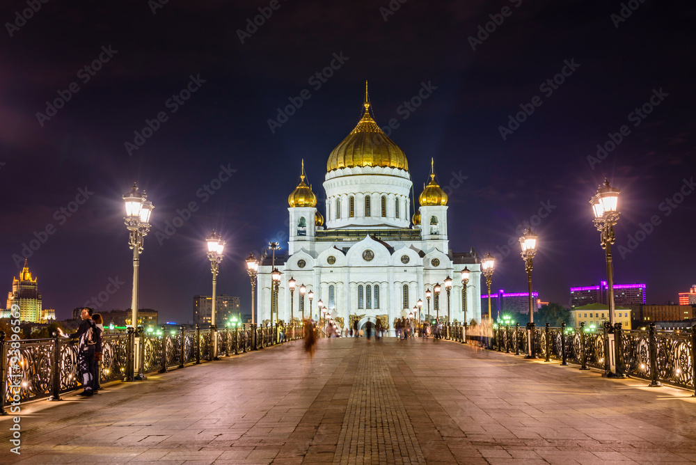 the Cathedral of Christ the Savior and Patriarchal bridge at night, Moscow, Russia.