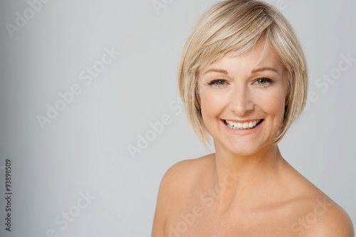 Undressed lady over grey background