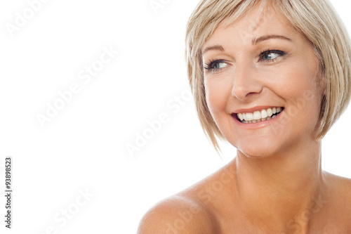 Topless smiling lady looking away
