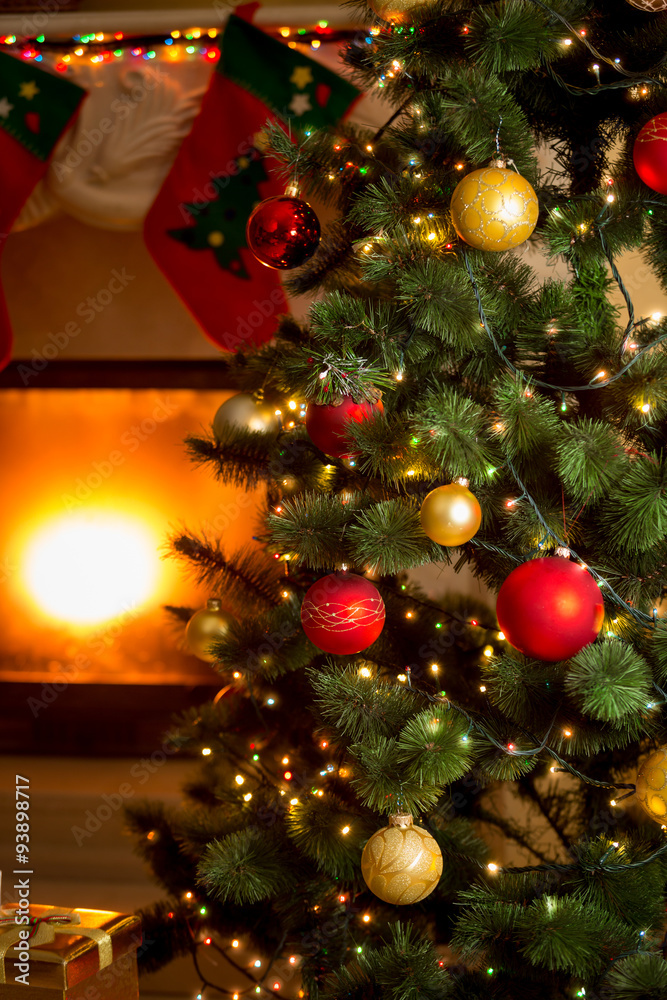 background of decorated Christmas tree and fireplace