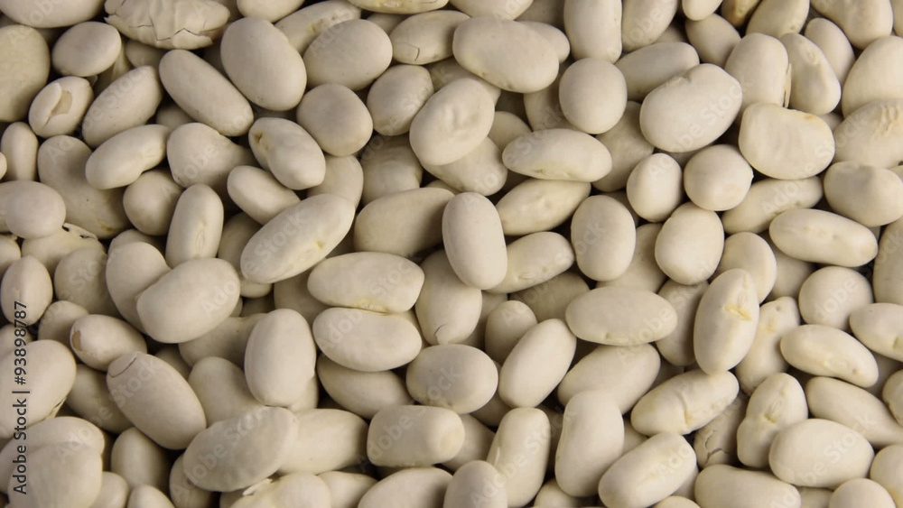 Raw dried beans rotating smoothly under studio lighting Raw dried beans rotating smoothly under studio lighting