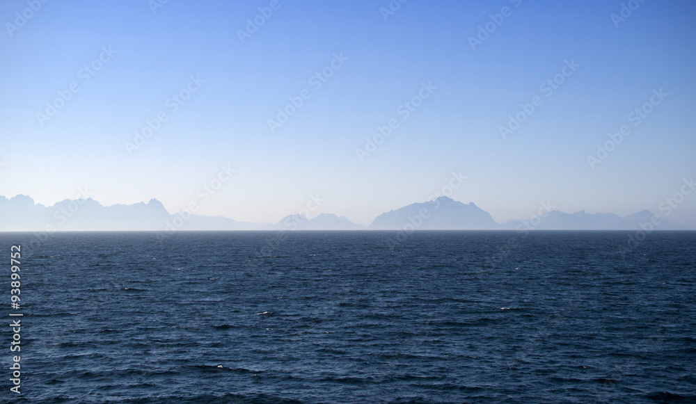 Silhouettes of Lofoten islands in the fog, Norway Silhouettes of Lofoten islands in the fog, Norway