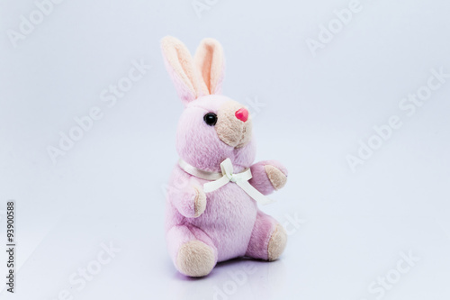Funny knitted rabbit toy isolated on white background © teerawit