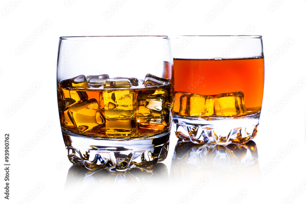 Glass of whiskey with ice isolated on white Glass of whiskey with ice isolated on white