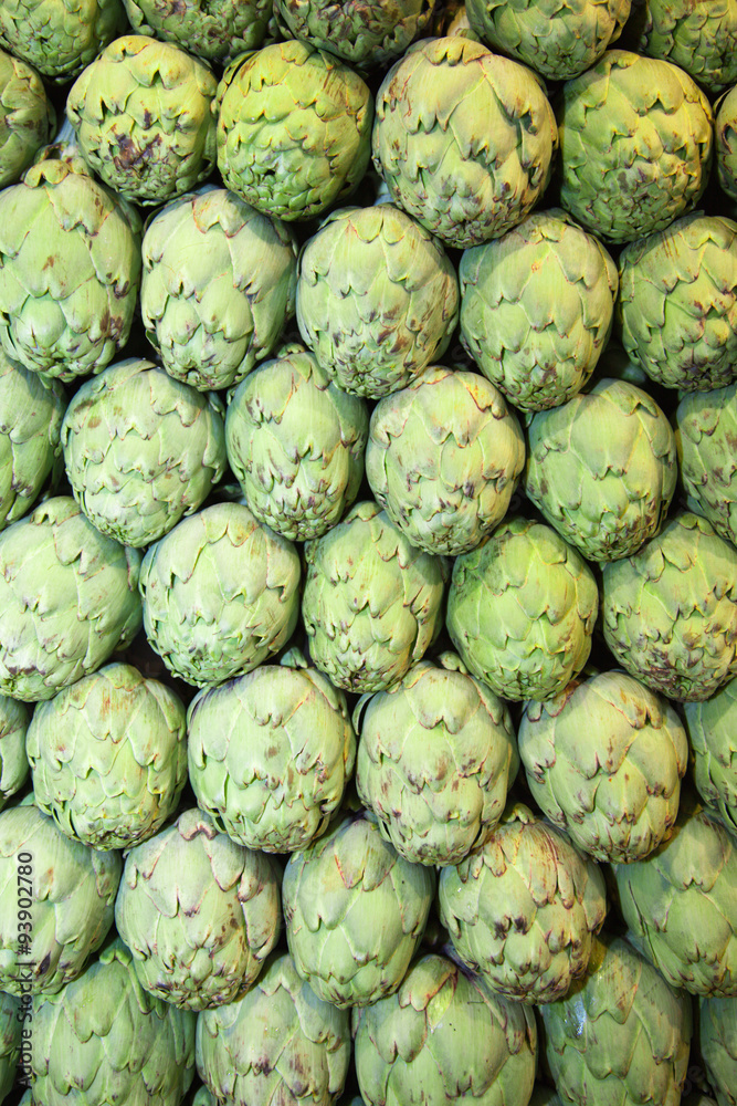 Fine stacked artichokes at market stall Fine stacked artichokes at market stall