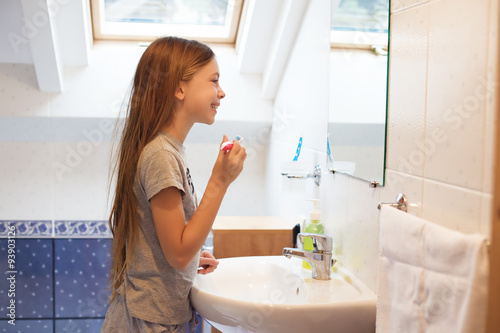 Girl brushing her teeth