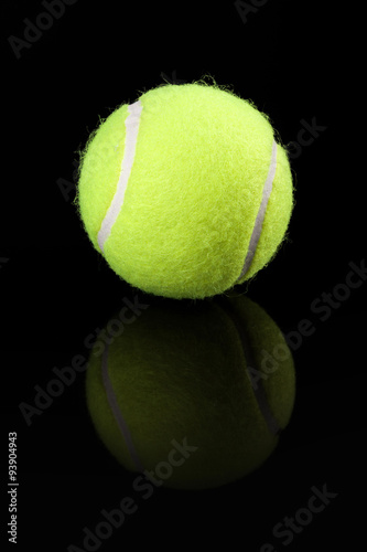 Tennis ball on black background © cristovao31