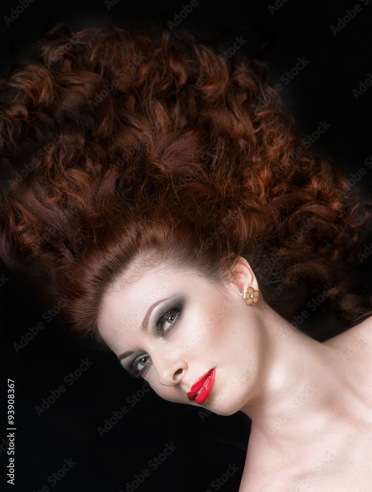 Fototapeta premium Girl with long brown hair lying on the floor, view from above