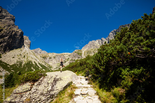 Yoga exercising in Tatry mountains photo