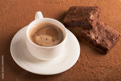 Cup of cappuccino and chocolate brownies