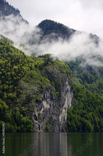 Rock and clouds over the water photo