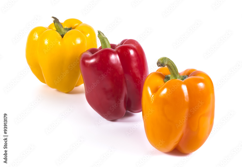 Multicolor sweet peppers isolated on white Multicolor sweet peppers isolated on white